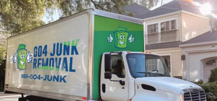 A white truck with "Go4 Junk Removal" and a cartoon dumpster graphic on its side is parked on a residential street near large houses. Phone number 866-GO4-JUNK is displayed on the truck.